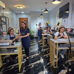 Nail technician students learning international manicurist skills inside the London Fashion Nails academy classroom in Silang, Cavite near Metro Manila